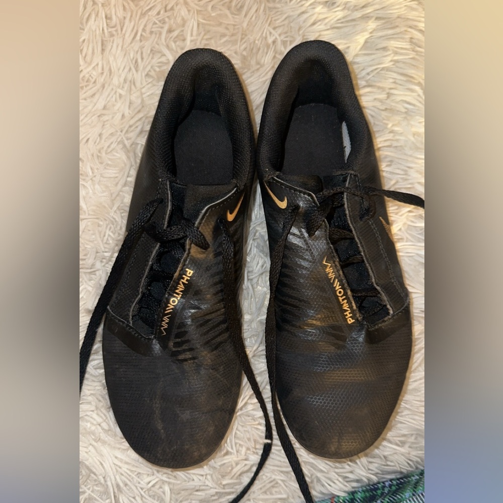 Worn Nike cleats size “5Y US”